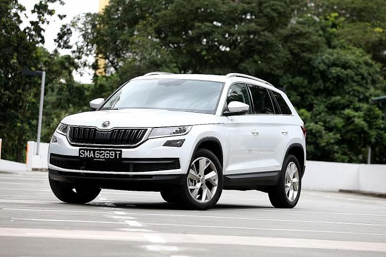The Kodiaq drives more like a sporty hatchback than an SUV, with quick and sharp steering. Its start button is located on the steering column (left), where the ignition key usually goes, and its doors are equipped with door edge protection - a plasti
