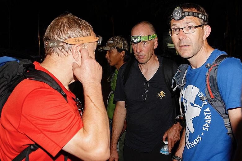 British cave divers (from right) John Volanthen and Richard Stanton, who discovered the boys and their coach alive inside the cave.