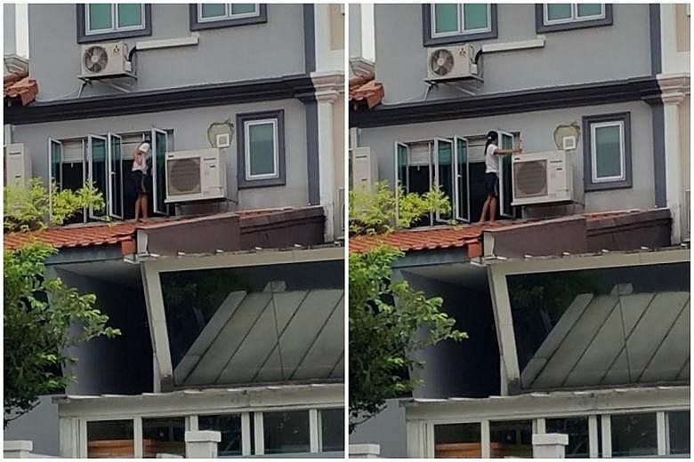 The woman, believed to be a maid, cleaning the windows of a Loyang Avenue home while standing on the roof at around 7.30pm on Monday.