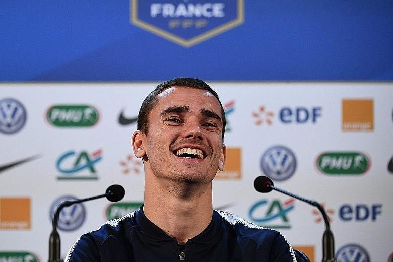 France striker Antoine Griezmann in a relaxed mood at the team's training base outside Moscow yesterday, ahead of tomorrow's World Cup final against Croatia. He took a swipe at Belgium's Thibaut Courtois for criticising France's style of play in thei
