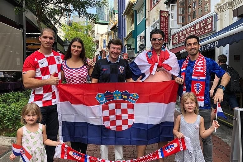 Croatians living in Singapore who will be giving their full-throated support to the national team tonight include (form left) Mato Njavro, Iva Bojic, Sasha Mavrovic, Leo Bakaric and Ivan Livic. Mr Bakaric's children have also caught the football feve