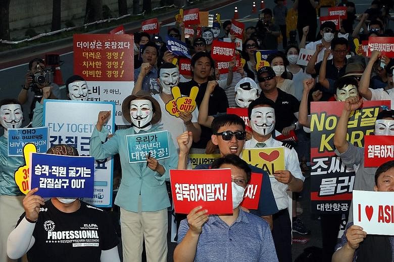 Korean Air and Asiana Airlines employees protesting in Seoul.