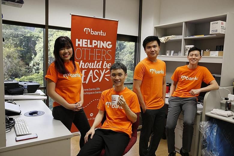 Mr Nicholas Ooi (seated) and NUS mates (from left) Janelle Lee, Han Lynn and Joshua Foong started social enterprise Bantu, which uses technology to manage volunteers in the social service sector. Mr Nicholas Ooi, who earned an honours degree in compu