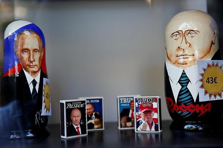 Matchboxes with pictures of Russian President Vladimir Putin and US President Donald Trump in a shop window in Helsinki, Finland, yesterday, ahead of the historic summit between the two leaders today.