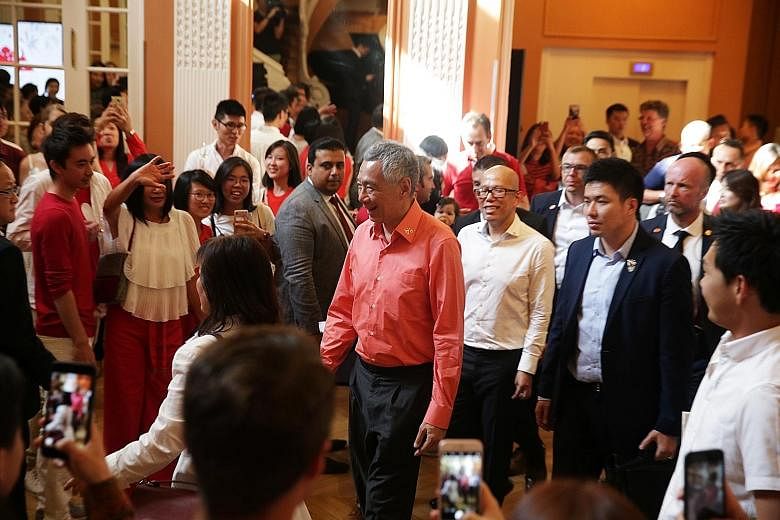 Prime Minister Lee Hsien Loong meeting the Singaporean community in France at the Hotel des Arts et Metiers in Paris on Saturday night.