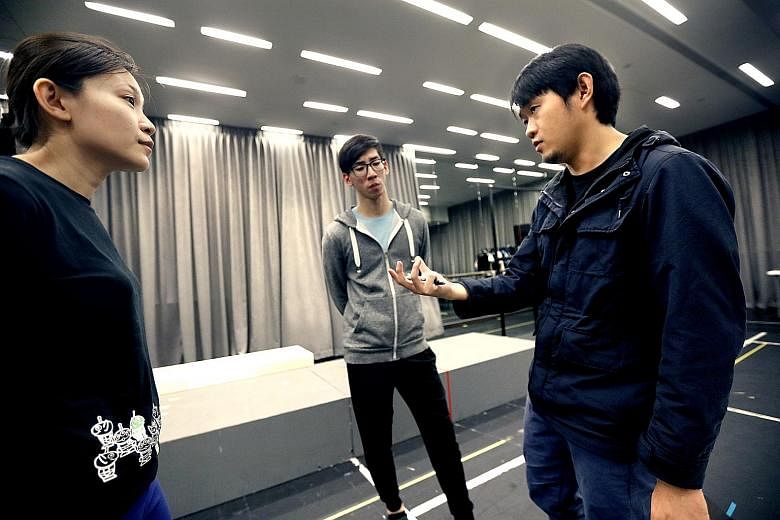 (From left) Performers Holene Wong and Darren Guo, and director Stanley Seah at a rehearsal.