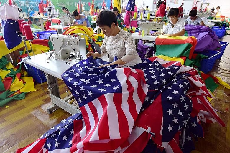 Business is good at Jiahao Flag Company in Anhui province even as the United States-China trade war rages. Workers bustle and sewing machines buzz to turn out American-themed flags, which are among its top sellers. Among hot sellers are the banners d