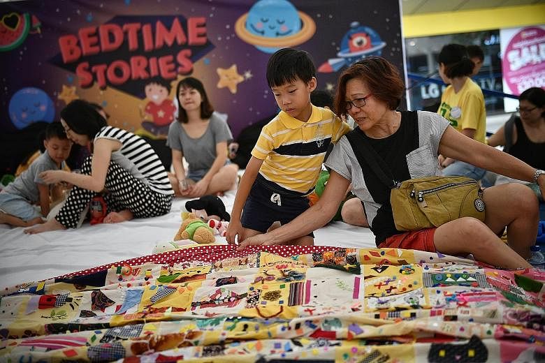 Visitors to an event in Toa Payoh Central could be forgiven for wanting an early night, as it features a mega-sized children's bedroom. Retiree Leong Fong Mei, 66, and her seven-year-old grandson Aegen Chiang were among those who admired a giant patc