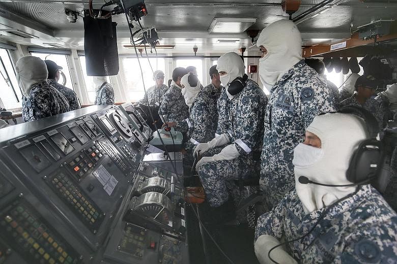 The crew of RSS Vigilance executing a series of naval operations as part of their in-camp training.