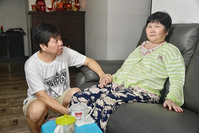 Madam Ang Liu Kiow at home yesterday with her husband, Mr Leong Loon Wah, who says her condition has improved since the 2016 crash, which left her in a month-long coma.