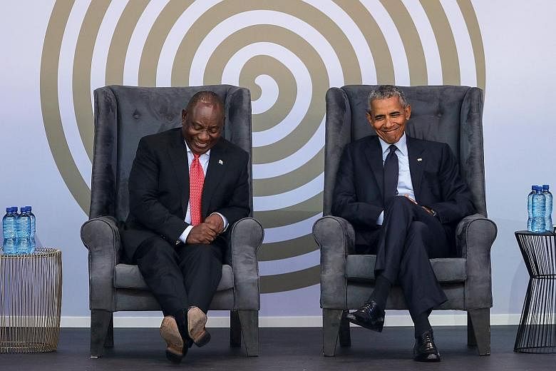 South African President Cyril Ramaphosa and former US president Barack Obama at the Nelson Mandela Annual Lecture held at the Wanderers cricket stadium in Johannesburg yesterday.
