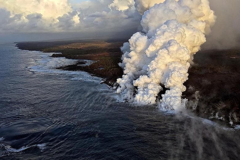 Above: A gaping hole in the roof of the tour boat that was struck by a blob of hot volcanic lava from the Kilauea volcano in Hawaii on Monday. Left: Plumes rising as lava poured into the sea on Sunday.Some tour boat passengers pay about $300 each for