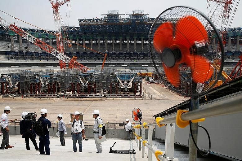 Electrical fans out in force during a heat wave at the construction site of the main stadium of the Tokyo 2020 Olympics. Experts have warned of the risk of heatstroke at the Games, and organisers are taking the issue seriously as they consider a raft