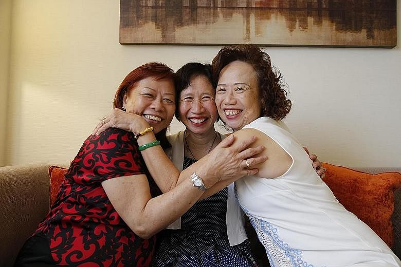 Mrs Eileen Kwong (centre) and her long-lost sisters, Madam Lily Wong (left) and Madam Jasmine Wong. Mrs Kwong said she never forgot her encounter in her teen years with a stranger on a bus who said she was her sister.
