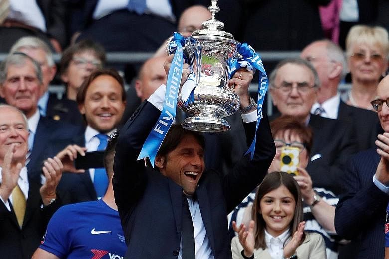 Chelsea manager Antonio Conte lifting the FA Cup - his second and final trophy with the Blues - in May. He had been resigned to being dismissed as far back as January and wants to be compensated for the lack of clarity.