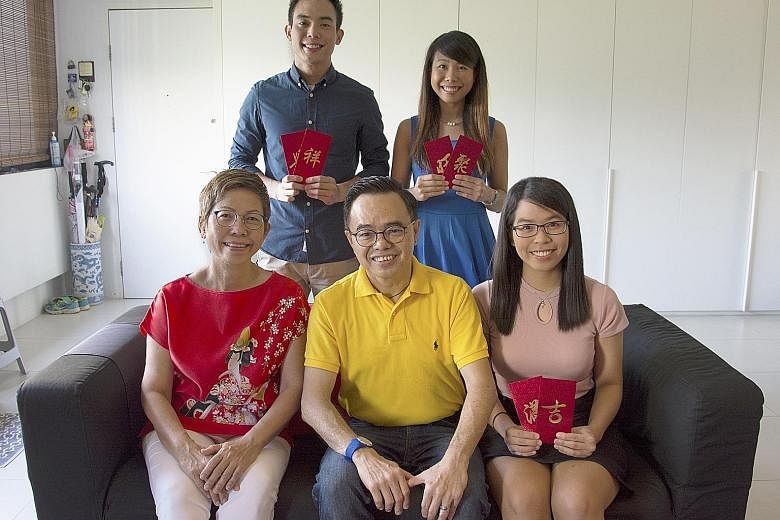 Mr and Mrs Foong with (from left) Ivfeno, Ivfen and Ivfy during Chinese New Year last year. The three siblings knew how they were conceived when they were young. "We were featured in an article in The Straits Times (when we were) in primary school an