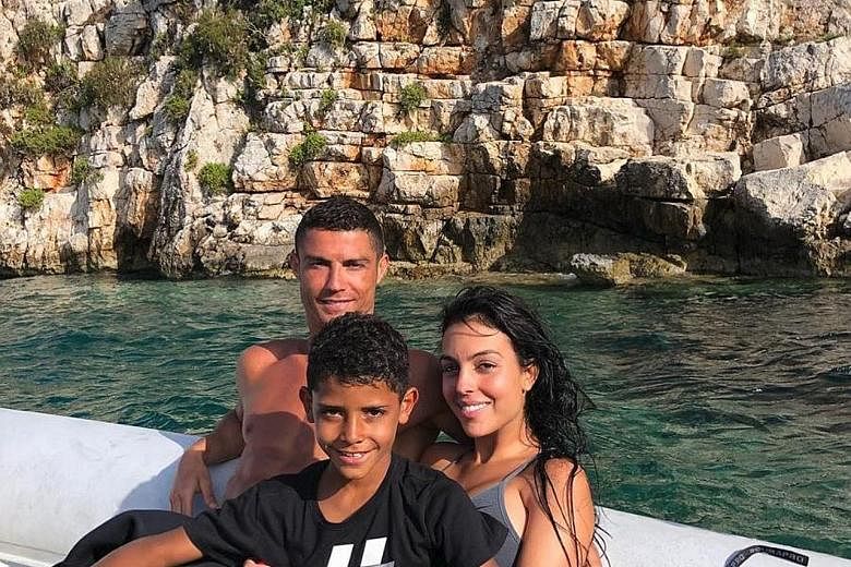 Cristiano Ronaldo pictured with his girlfriend Georgina Rodriguez and son Cristiano Jr in Greece last week. His undeniable marketability is a major factor in Juventus' policy of appealing to a new demographic.