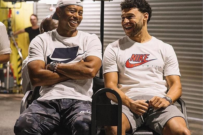 SWEET TWEET "Good vibes filming + putting with the master @tigerwoods this weekend. Good luck at the Open!" England footballer Alex Oxlade-Chamberlain spending his rehabilitation in good company. CAUGHT ON CAMERA "How about this lie Kevin Na got on 1