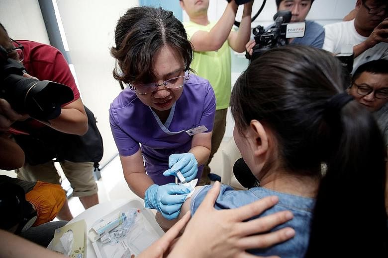A patient receiving a vaccine injection at a hospital in Boao in Hainan province.