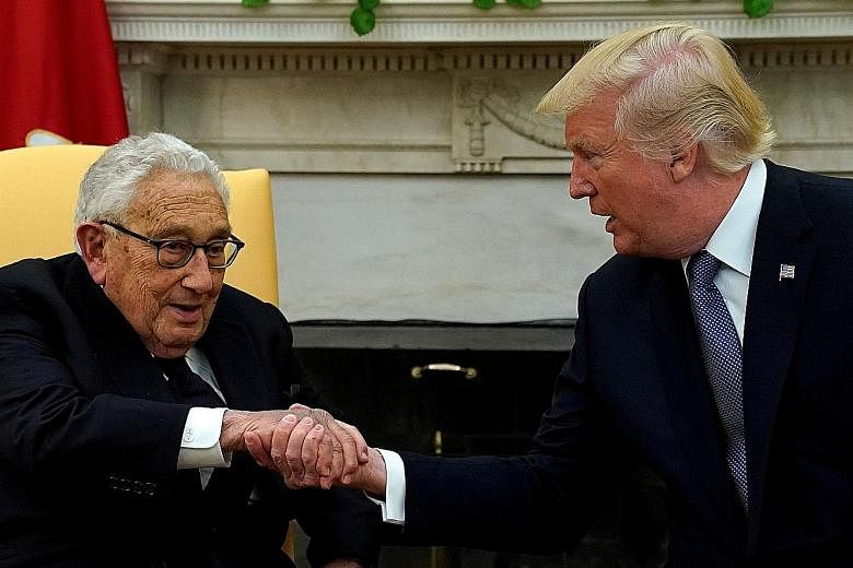 US President Donald Trump meeting former secretary of state Henry Kissinger at the White House in Washington last October. Asked if Mr Trump could be shocking the rest of the West to stand on its own feet, Dr Kissinger tells the writer: "It would be 