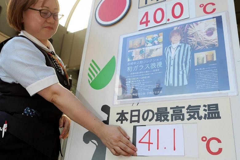 Tokyo sizzles amid record June temperature in 147 years
