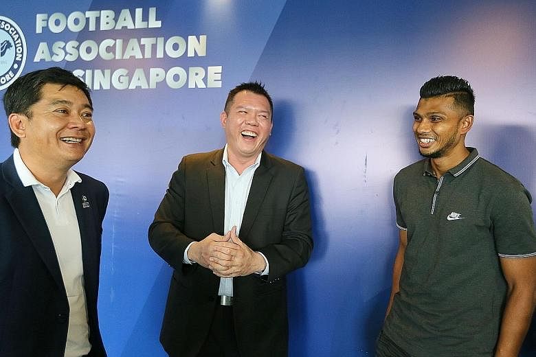 From left: FAS deputy president Bernard Tan, PSB Academy CEO Derrick Chang, and Hougang United striker Fazrul Nawaz, the first beneficiary of the tie-up.