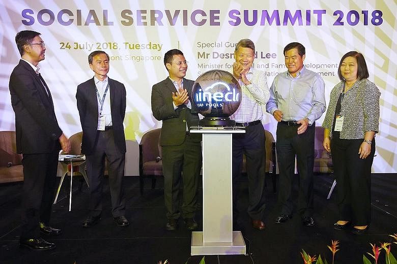 Minister for Social and Family Development and Second Minister for National Development Desmond Lee (third from left) at the launch of the non-profit IT company iShine Cloud, a collaboration between Singapore Pools and NCSS, at the Social Service Sum