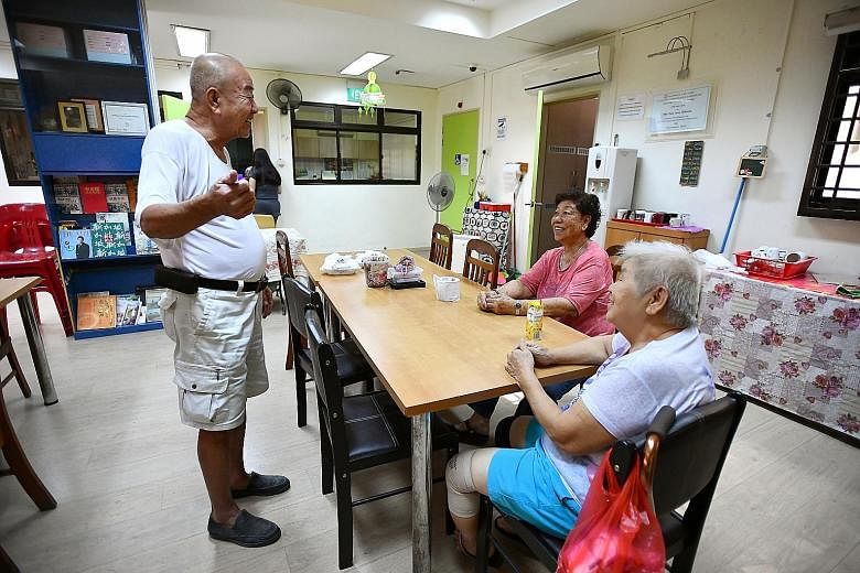 Mr Li (in white) and other volunteers at the Kembangan-Chai Chee Seniors Activity Centre pack hampers to be delivered to elderly residents. He is one of the oldest volunteers there.