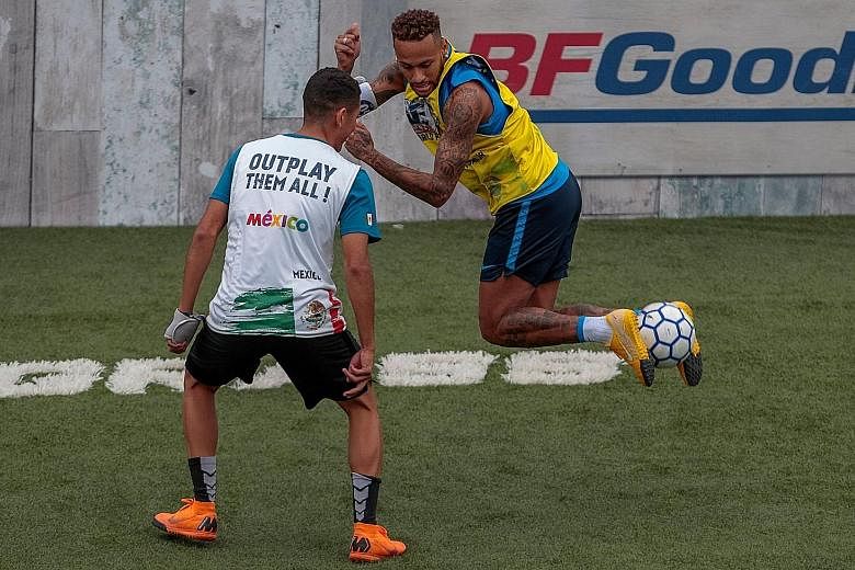Brazil star Neymar, who is on an extended break after the World Cup, enjoying himself as he hosted a five-a-side tournament for his charity Neymar Junior Project Institute in Praia Grande, Sao Paulo, Brazil, last Saturday.