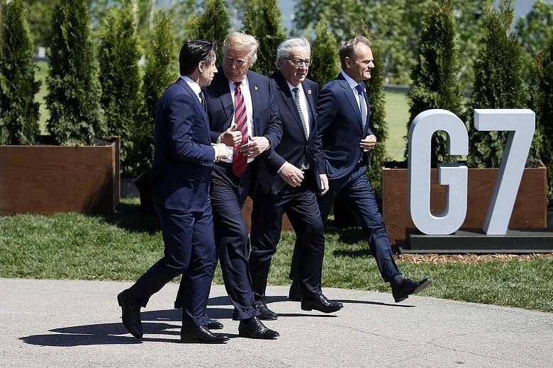 From far left: Italy's Prime Minister Giuseppe Conte, US President Donald Trump, European Commission president Jean-Claude Juncker and European Council head Donald Tusk at the Group of Seven summit in Canada last month.
