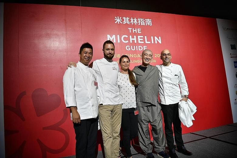 Above: Celebrating their restaurants' new Michelin stars are (from left) chef Lam Hon Tim from Jiang-Nan Chun, chef Mathieu Escoffier from Ma Cuisine, Ms Katrina Wheeldon from Burnt Ends, chef Tomoo Kimura from Sushi Kimura and chef Ivan Brehm from N