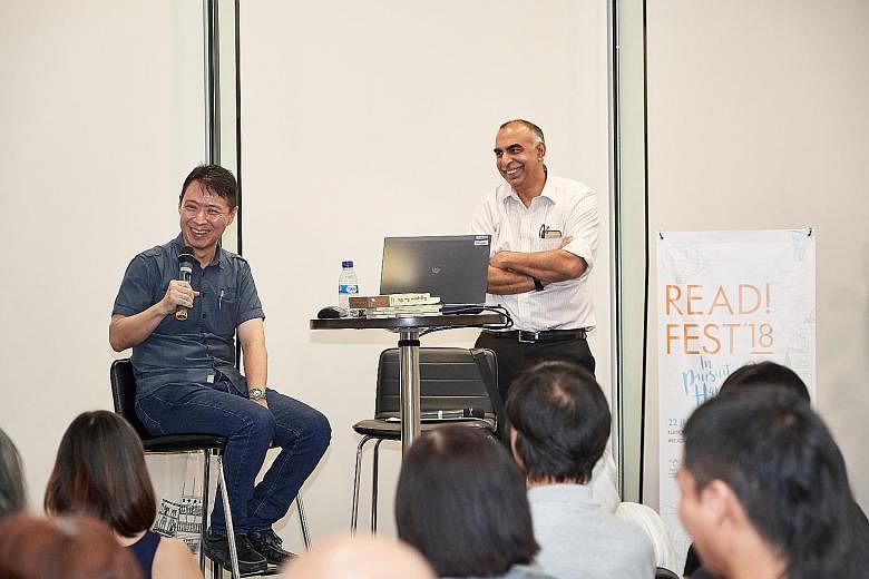 Local author Felix Cheong (left) with ST assistant sports editor Rohit Brijnath at The Straits Times Book Club yesterday. Cheong's latest work is a children's picture book titled Use Your Head.
