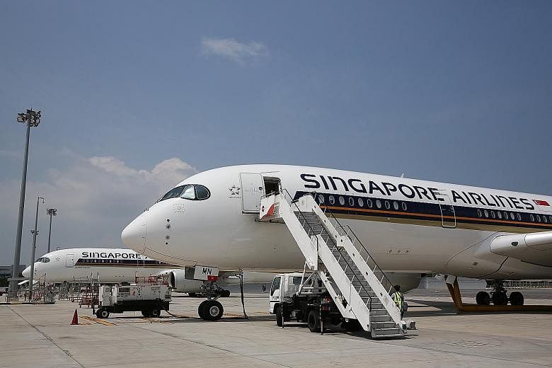 Operating profit for Singapore Airlines' parent airline roughly halved from $370 million to $181 million in the absence of one-off items.