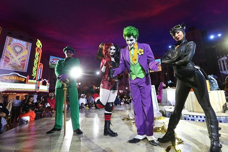 DC Comics characters on stage during the official opening of the Warner Bros World theme park on Yas Island in Abu Dhabi. The complex (above left), which opened to the public on Wednesday, boasts 29 rides and six themed areas - including the fictiona