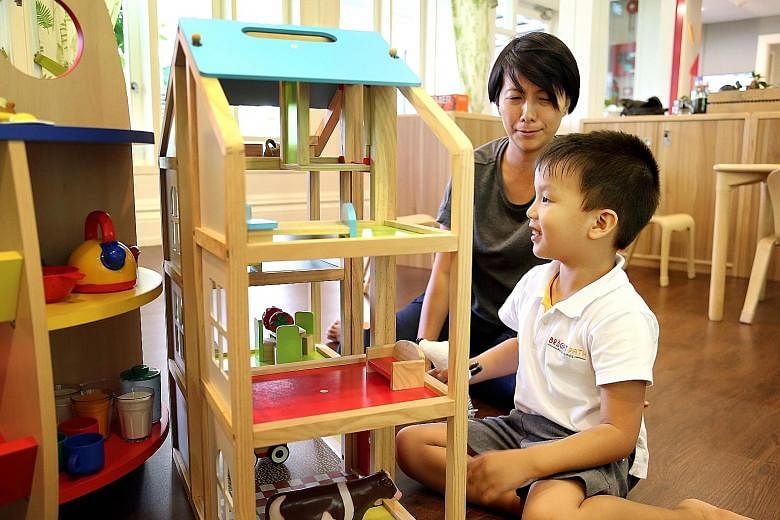 Ms Foo Wann Yun (above) with her 41/2-year-old son Russell, who has autism, at Bright Path Preschool. The pre-school offering inclusive education helps children develop their gross motor skills with a sensory path and its maths lessons include water play.