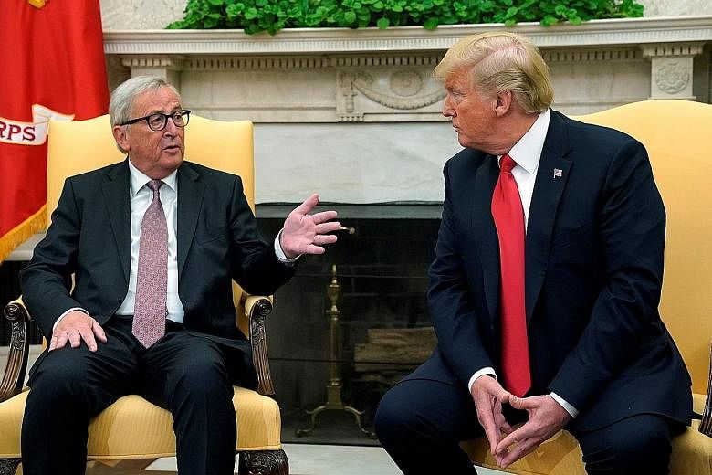 US President Donald Trump (right) meeting European Commission President Jean-Claude Juncker at the White House on Wednesday. The deal between the two men to suspend new tariffs while negotiating over trade has drawn mixed views from analysts over how
