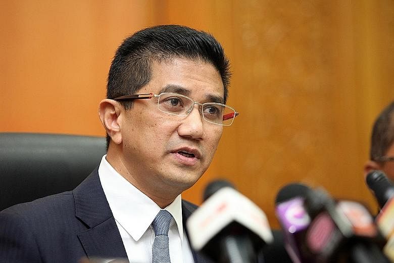 Economic Affairs Minister Azmin Ali (top) is PKR's deputy president, a post which PKR vice-president Rafizi Ramli intends to run for in next month's party polls. The two are from rival party factions.