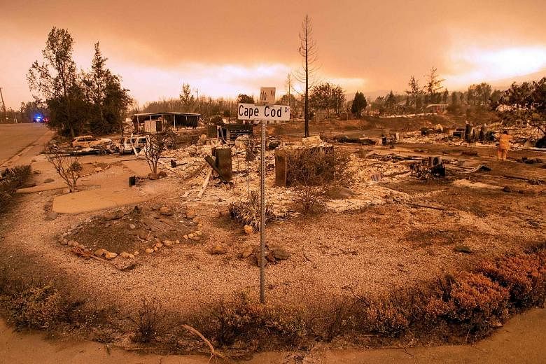 Burnt-out homes in Redding, California. The deadly fire killed two firefighters and sent 38,000 fleeing from their homes.