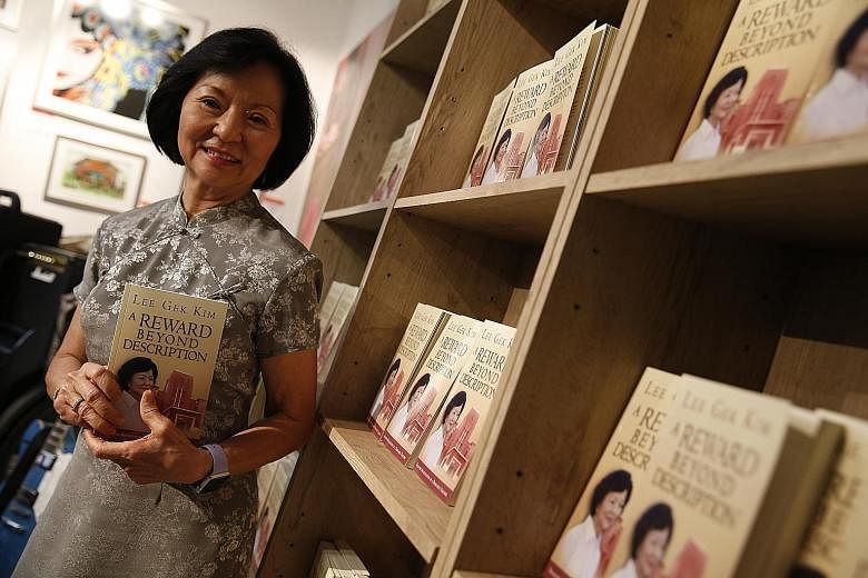 Mrs Lee Gek Kim with her book, A Reward Beyond Description, which describes her 50 years as a teacher. One of the highlights of her career was seeing all 43 Anglo-Chinese School students of 1988's Secondary 4A class score an A1 for English literature