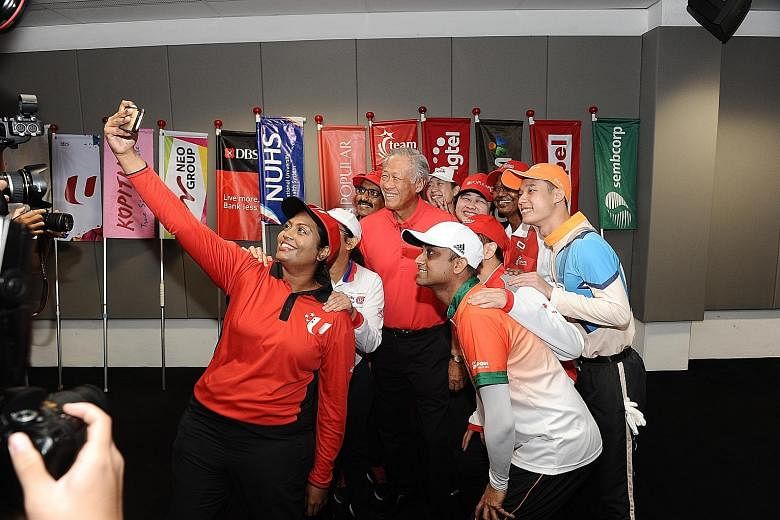 Defence Minister Ng Eng Hen posing for a "wefie" with performers preparing for yesterday's National Day Parade (NDP) preview. Dr Ng visited the F1 Pit Building and met the performers before the preview started. He wrote on Facebook after the visit: "