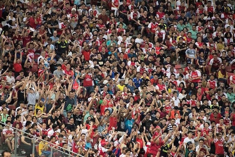 It was a sea of red-and-white as Arsenal fans dominated the turnout at last night's ICC game against Paris Saint-Germain at the National Stadium.