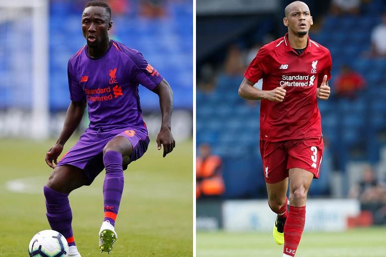 Liverpool have spent heavily this year on transfers, splashing more than £200 million (S$357 million) on signings, including for Naby Keita (left) and Fabinho (right).