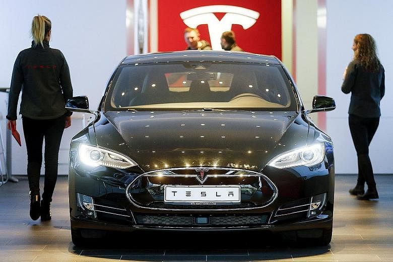 A Tesla Model S car at a dealership in Berlin, Germany. Tesla and Apple are some of the prominent companies unveiling their results, which are bound to capture the market's attention after Facebook's monster sell-off last week.