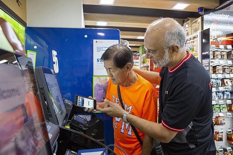 DBS employees, including DBS chief executive officer Piyush Gupta (right), took some 40 senior beneficiaries from social service organisation Lions Befrienders on a sponsored grocery shopping trip last Friday. The event celebrated the seniors' comple