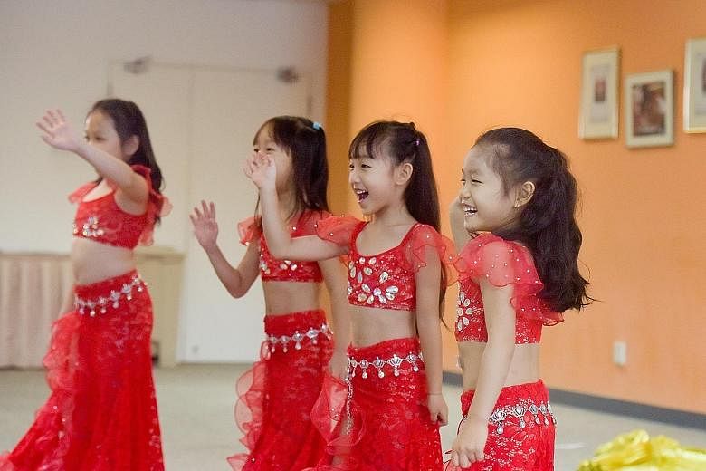 Hoping to land a spot in this year's ChildAid concert, six-year-old Valerie Ching (right) auditioned not once but twice - first playing the violin, and later belly dancing with three other girls aged six to seven in the group Shakiya Little F4. The "