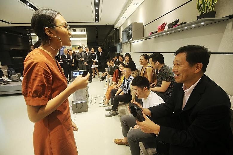 Education Minister Ong Ye Kung with Charles and Keith Group's fashion coach Jazlina Jumale during his visit to the shoe retailer yesterday. He announced the launch of the new training institute at the company's headquarters. The home-grown brand is a