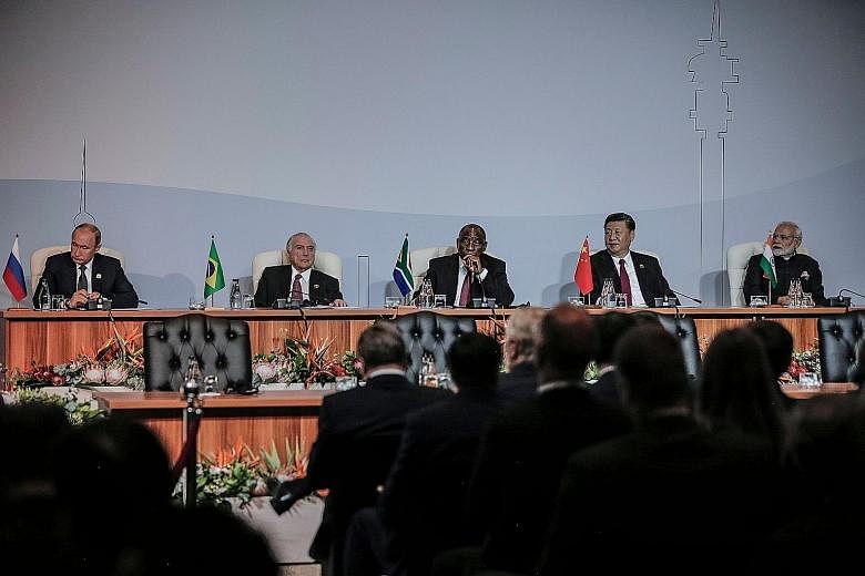 (From left) Brics leaders Vladimir Putin of Russia, Michel Temer of Brazil, Cyril Ramaphosa of South Africa, Xi Jinping of China and Narendra Modi of India attending the 10th Brics summit on Thursday.