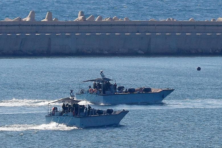 Israeli navy ships at the military port of Ashdod, Israel, on Sunday. The navy had intercepted a Norwegian-flagged activist boat trying to break a decade-plus blockade of the Gaza Strip, said the military and an activist group. The boat carrying 22 p