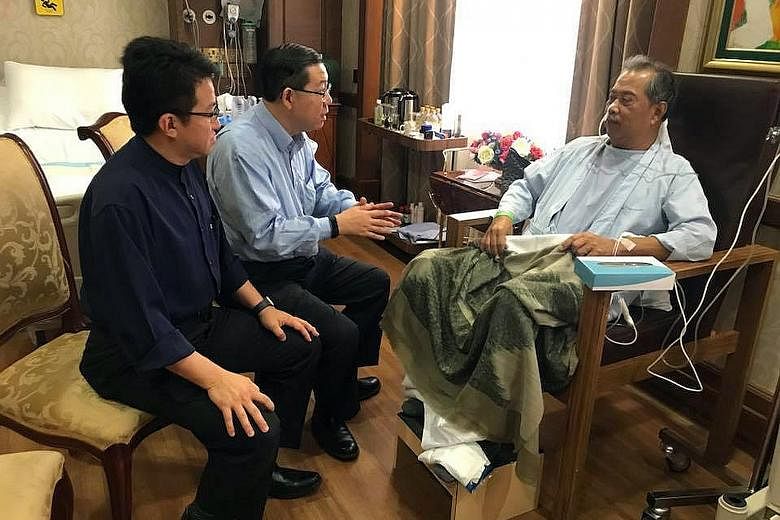 Below: (From left) Deputy Defence Minister Liew Chin Tong and Finance Minister Lim Guan Eng with Tan Sri Muhyiddin. Left: Malaysian Home Affairs Minister Muhyiddin Yassin being visited by (from far left) Education Minister Maszlee Malik and Deputy Pr