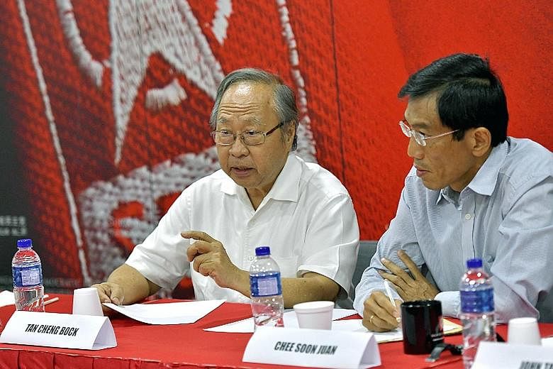 Former PAP MP Tan Cheng Bock (left) and SDP chief Chee Soon Juan at Saturday's meeting. Efforts to form an alliance had been ongoing without success, but the Malaysian election result was a turning point, said opposition leaders.